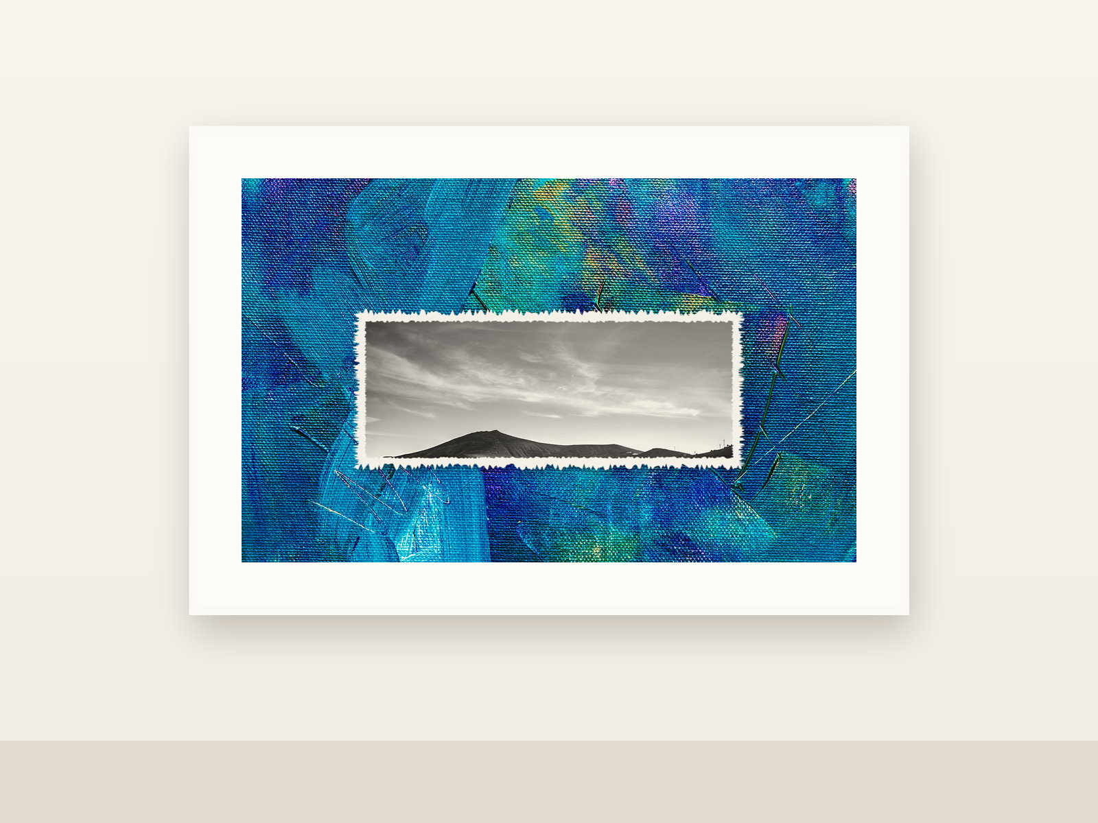 Tideline, a mixed-media work on a white gallery wall: a black and white shoreline photograph set into blue paint